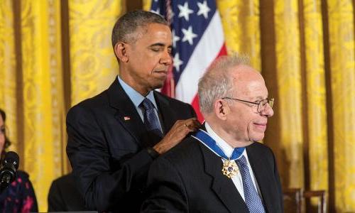 President Obama awarding a medal to a member of the UCS board